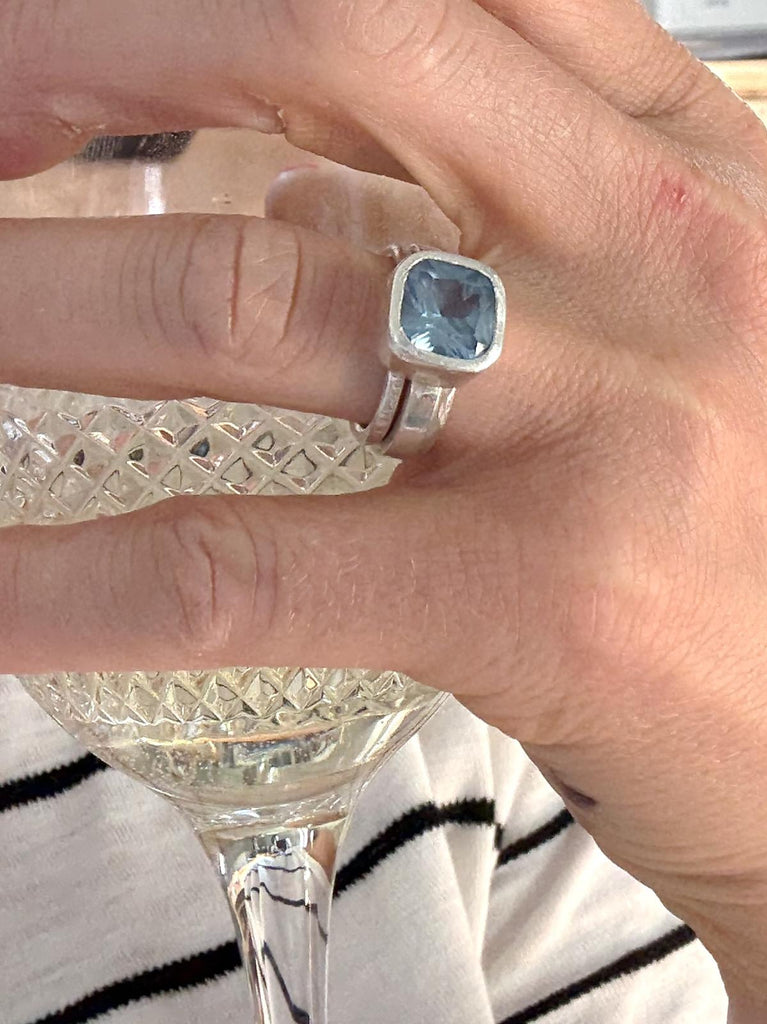 Cushion cut, faceted aqua spinel set in sterling silver on statement ring