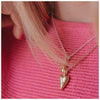 A 9ct gold heart-shaped pendant necklace stacked with a gold droplet necklace