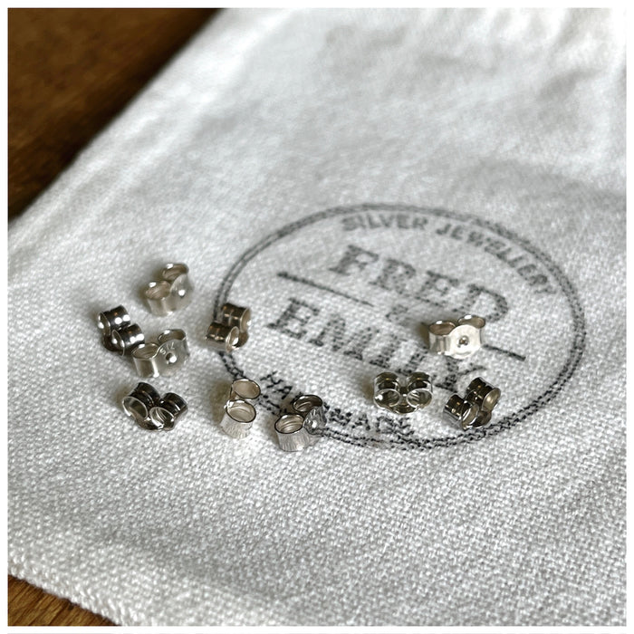 Earring scrolls, butterflies, earring backs