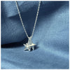 A silver pendant featuring two guiding stars charms attached to a small chain, displayed against a blue background.