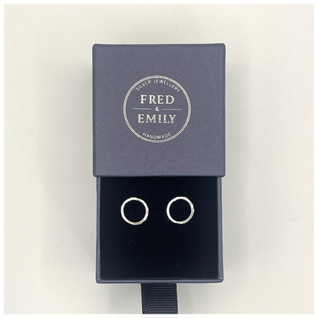 Mini halo or circle stud earrings set in a Navy Fred & Emily Blue Box