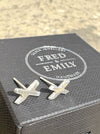 Silver Kiss earring studs sitting on a Fred & Emily Jewellery Box