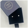 Tiny dot studs or earrings made from  sterling silver in a blue Fred & Emily Box