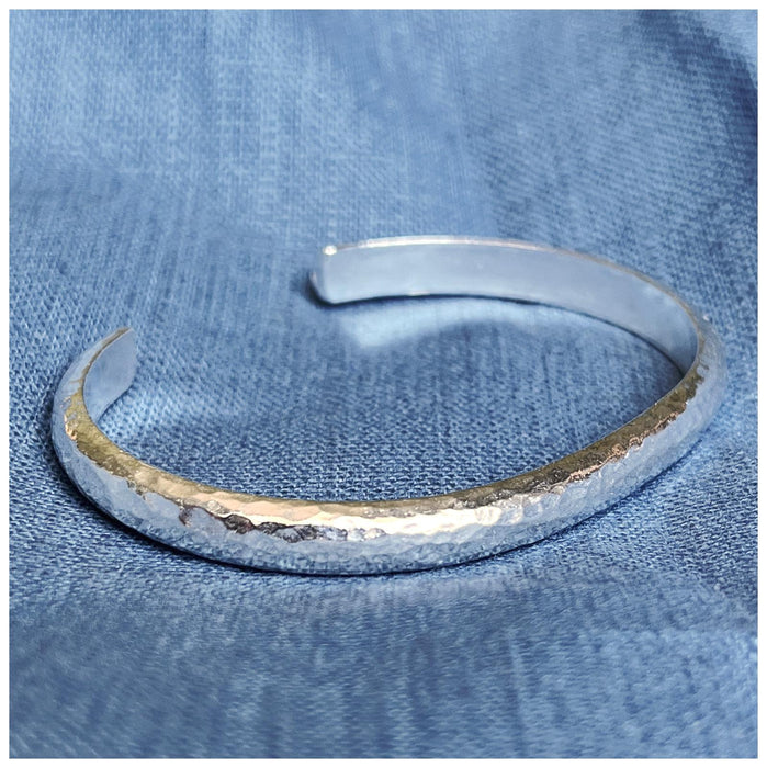 Solid silver cuff, with  a hammered effect.